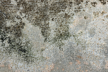 Real weathered concrete wall with a heavy grunge texture. Featuring stained, dirty and distressed surface, perfect for urban backgrounds, edgy design, dramatic overlay, textural element.