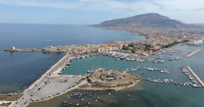 Aerial view of Trapani, Sicily, Italy. It is a Sicilian city overlooking the Mediterranean Sea. Mount Erice dominates the town in the background.
