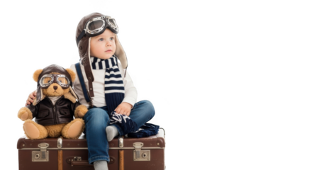 Child in pilot costume with teddy bear on suitcase isolated on transparent background