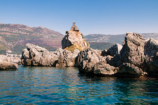 Tiny Church of St Sava on rocks above the sea near Petrovac, Montenegro