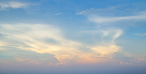 Sun shining through the puffy clouds. Sky view. Beautiful sunny sky. Background with clouds on blue...