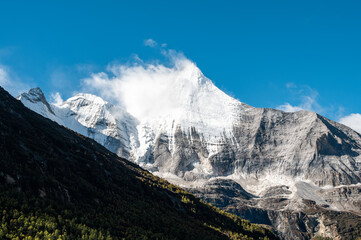 Mount Jambeyang(Yangmaiyong), a famous snow-capped mountain in the eastern part of the Qinghai-Tibet Plateau, Daocheng Yading, Sichuan, China
