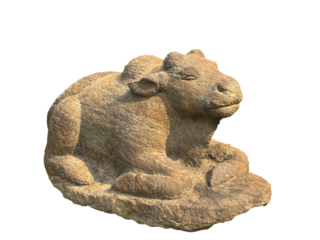 Ancient stone sculpture of Nandi, Lord Shiva's sacred bull mount, seated in devotion. A timeless Hindu temple artifact symbolizing purity and patience.
