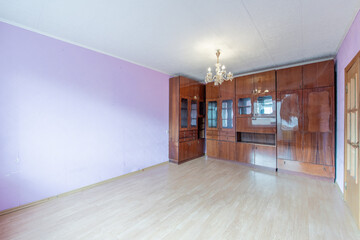 Empty, No People Living Room Interior. White Ceiling, Magenta Color Walls and Dark Brown Color Wooden Wardrobe.