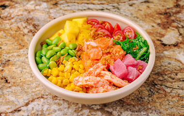 Colorful poke bowl with fresh ingredients in a round dish