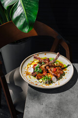 Delicious meal of lamb chops served on a stylish table