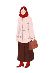 Woman in long brown skirt and pink jacket with red headscarf and boots holding handbag dressed for winter weather