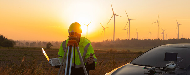 Survey Team Alternative energy for future. Engineers survey and checking wind turbines in sunset. Wind Turbine Renewable energy technology and sustainability. © kanpisut
