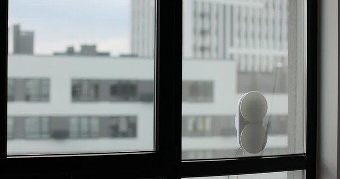 Robotic window cleaner, innovative automation for modern living and smart homes. Polishing of the glass surface.