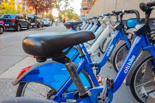 New York, NY, US-October 15, 2025: Close-up of row of bright blue itibikes at parking location along city street. Selective focus and blurred background.