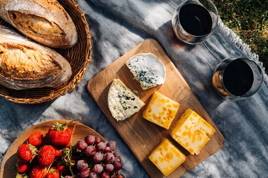 Picnic spread featuring locally sourced breads and cheeses Generative AI