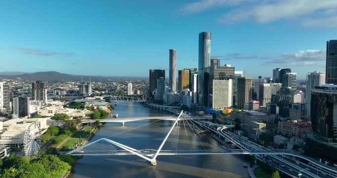 4K Aerial Locked off stationary motion of west side Brisbane CBD, known as South Bank Precinct with new buildings and new pedestrian bridge called Neville Bonner Bridge, Brisbane, QLD, Australia