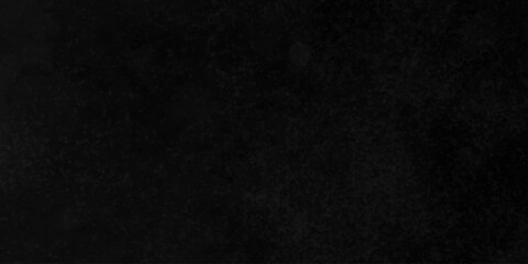 Distressed rough black cracked wall slate texture wall grunge backdrop smoke background. Stone concrete texture anthracite panorama. Old vintage charcoal night dark black stucco design.	