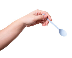Female hand holding a white plastic spoon isolated on white background.