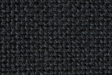 A macro close-up showcasing the rich, intricate textures of textile, tapestry, and leather materials