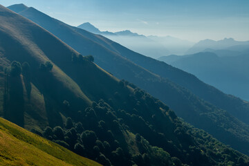 Scenic view of the mountains surrounding Como lake from Monte di Tremezzo on a sunny summer day