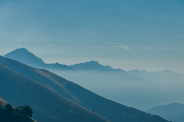 Scenic view of the mountains surrounding Como lake from Monte di Tremezzo on a sunny summer day