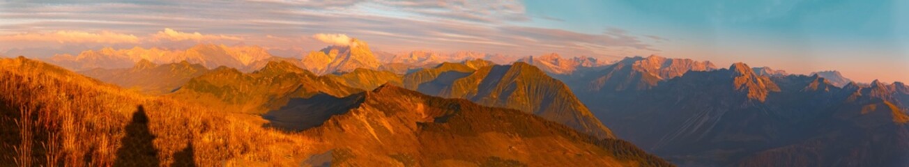 High resolution stitched panorama of an alpine sunset or sundowner at Mount Diedamskopf, Schoppernau, Bregenz, Vorarlberg, Austria