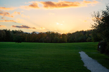 Landscape with a beautiful sunset and trees in autumn color at Rushcliffe Country Park in Nottingham, UK.