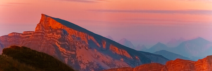 Alpine sunset or sundowner with amazing geological layers in rock formations and Mount Hoher Ifen seen from Mount Diedamskopf, Schoppernau, Bregenz, Vorarlberg, Austria