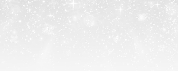 Magic winter background with snowflakes and shimmering light.
