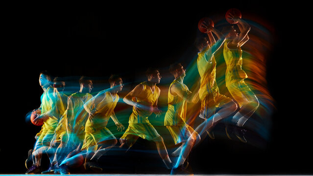 Basketball player sequence showing full jump motion with multicolor light streaks. Concept of movement study, kinetic energy, sports science, and athletic visualization.