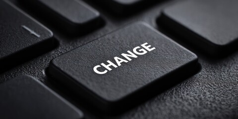 Close-Up of Black Keyboard Key with the Word Change in White Text