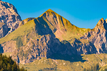 Alpine summer view with mountain peak details seen from Schoppernau, Bregenz, Vorarlberg, Austria