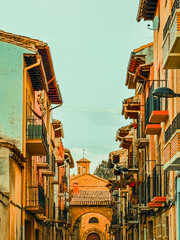 Beautiful street view of Old town in Sigues with sunlit facades and quiet charm