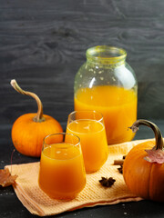 Homemade Pumpkin Juice in Glasses. Jarred Preparation