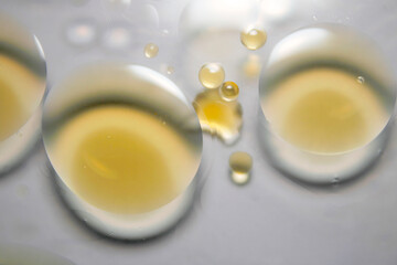Close-up of Clear Droplets on a Smooth Surface Reflecting Light