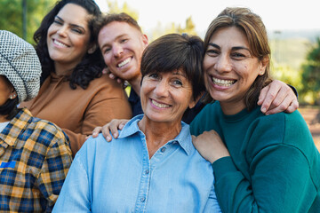 Group of multi generational people smiling in front of camera outdoor - Community, social...