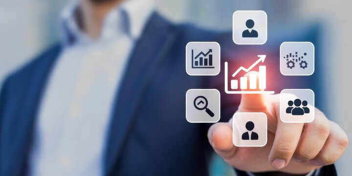 Digital touch of Success: A hand elegantly interacts with a digital interface adorned with business analytics icons, suggesting growth. 