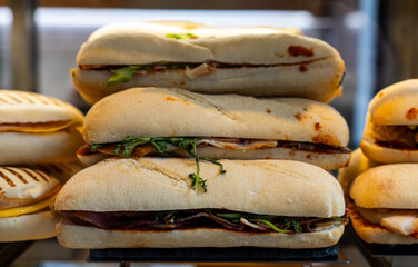 Fresh Italian Sandwiches Displayed in Café Showcase