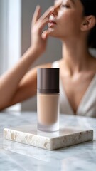 A sleek and minimalist product image featuring a luxurious skincare foundation, presented with clean lines and a refined aesthetic.