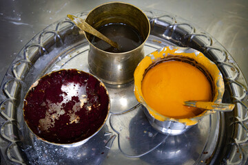 Containers with tilaka or tilka and bindi for the Hindu puja ceremony