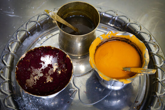 Containers with tilaka or tilka and bindi for the Hindu puja ceremony