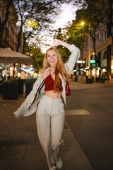 Fototapeta premium Young woman enjoying city night life in Vienna