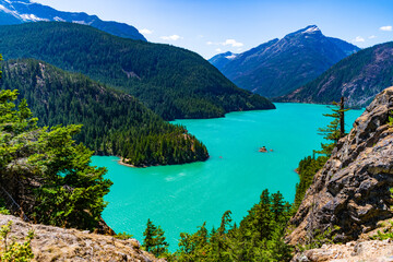 Obraz premium North Cascades. Nature landscape. Diablo Lake in North Cascades National Park. Scenic nature view over Diablo lake. Diablo lake with mountain landscape. Landscape of mountain peak and Diablo lake