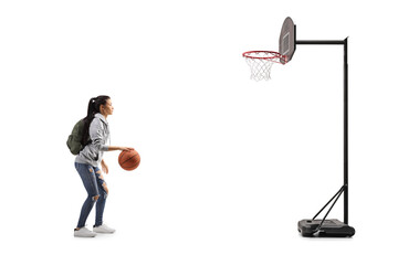 Fototapeta premium Female student training basketball