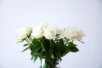 Pure white roses in gentle bouquet. A peaceful and elegant botanical scene.