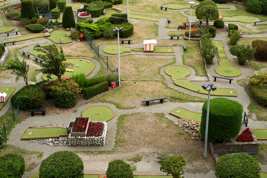 Aerial view of a miniature golf course with various holes and lush green landscaping. Blankenberge, West Flanders, Belgium