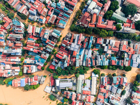 Aerial view of a colorful urban neighborhood with dense houses and lush greenery. Cao Bang city, Cao Bang, Vietnam