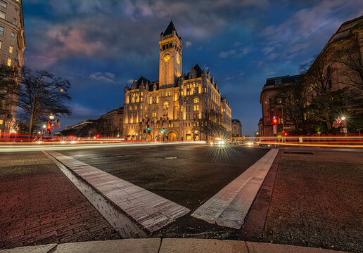 Evening view of a grand historic building under a deep blue sky with streaks of car lights. Washington DC, WA, USA