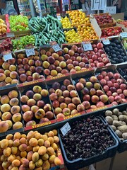 Abundant Display of Fresh Fruits and Vegetables at a Market Stall with Price Tags