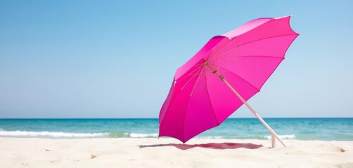 Vibrant pink beach umbrella casting shade on sand, pattern, support
