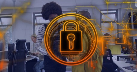 Four cybersecurity professionals analyzing holographic padlock overlay in open-plan office