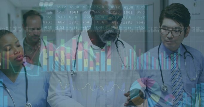 Consulting medical team examining data in hospital corridor, with stethoscopes and lab coats