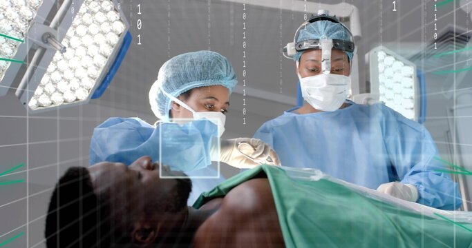 Female surgeons performing surgery in OR, with green drape, LED lights and digital overlay