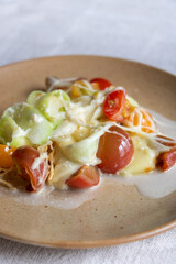 Recette de cuisine - plat avec des légumes - tomates et courgette au fromage